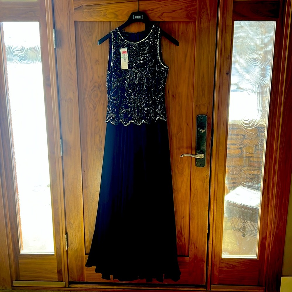 Brand new!  Full length sleeveless gown. Eggplant color with sequin bodice
